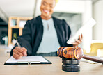 Legal, gavel and judge writing for an investigation document, contract or criminal case in a law firm. Court, administration and lawyer working on justice or planning policy in an attorney office