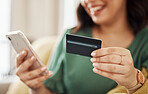 Phone, credit card and woman hands closeup with online shopping and banking at home. Ecommerce, mobile store and sale with digital payment on a web retail shop with discount and smile from website