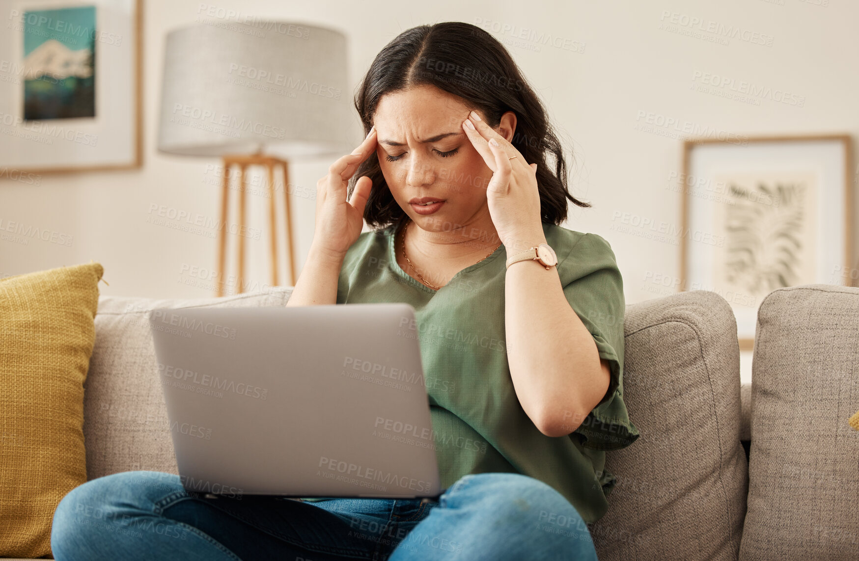 Buy stock photo Woman, home and headache with laptop learning and remote work stress on a sofa feeling frustrated. House, female person and confused from computer problem with anxiety from online website project