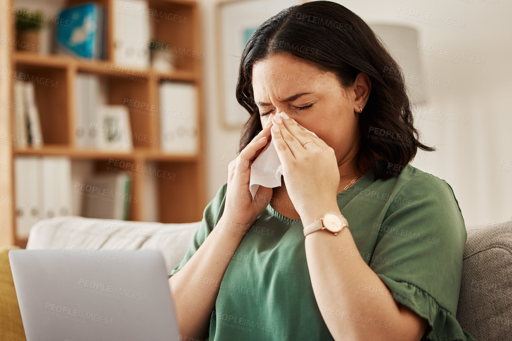 Buy stock photo Remote work, laptop and sick woman on a sofa with flu, cold or viral infection in her house. Freelance, sneeze and lady online with allergies, virus or burnout, sinusitis or hayfever while working