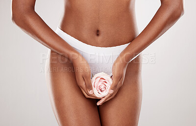 Buy stock photo Woman, rose and hands with feminine hygiene and natural beauty in a studio. Body wellness, flower and model with white background and gynecology health with clean and eco friendly self care treatment