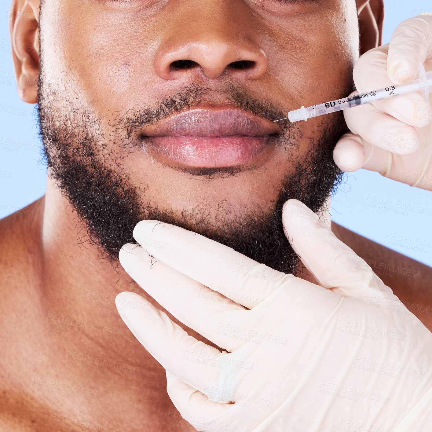 Buy stock photo Man, plastic surgery and needle in studio for lips, filler and beauty for face transformation by background. African patient, model or surgeon hands for skincare, syringe or dermatology for aesthetic