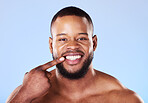 Teeth, dental care and portrait of black man mouth after cleaning or hygiene isolated in a blue studio background. Healthcare, dentist and happy person showing his oral beauty smile for health