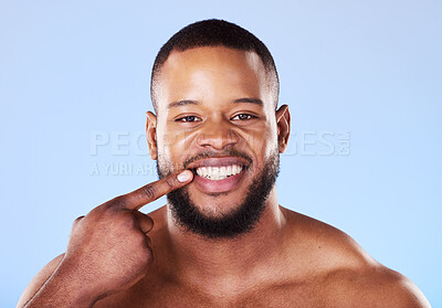 Buy stock photo Teeth, dental care and portrait of black man mouth after cleaning or hygiene isolated in a blue studio background. Healthcare, dentist and happy person showing his oral beauty smile for health