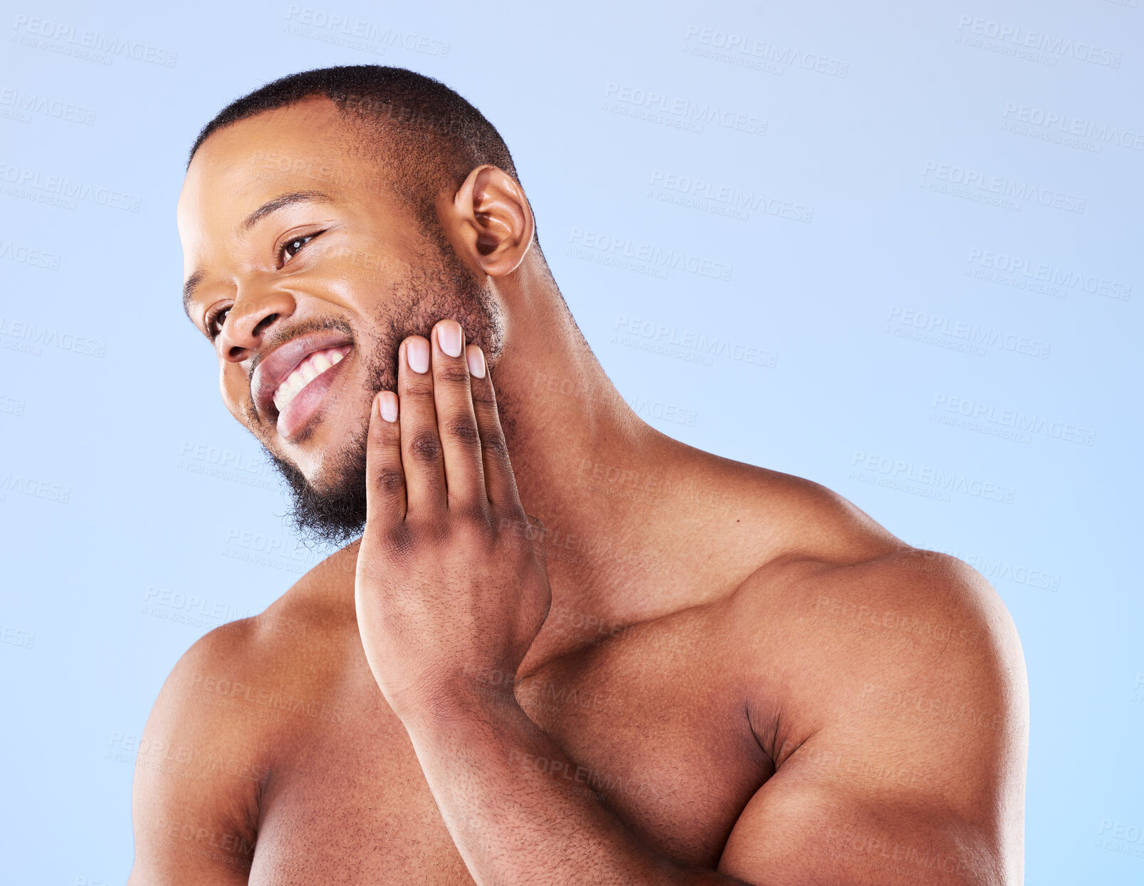 Buy stock photo Cosmetics, cleaning and black man with skincare, muscle and grooming against a blue studio background. Male person, model and guy with treatment, shine and glow with dermatology, aesthetic and health