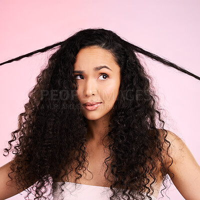 Buy stock photo Hair damage, natural beauty and confused woman with growth treatment and hairstyle problem. Cosmetics, face and female person in studio worried from shampoo care and split ends with pink background