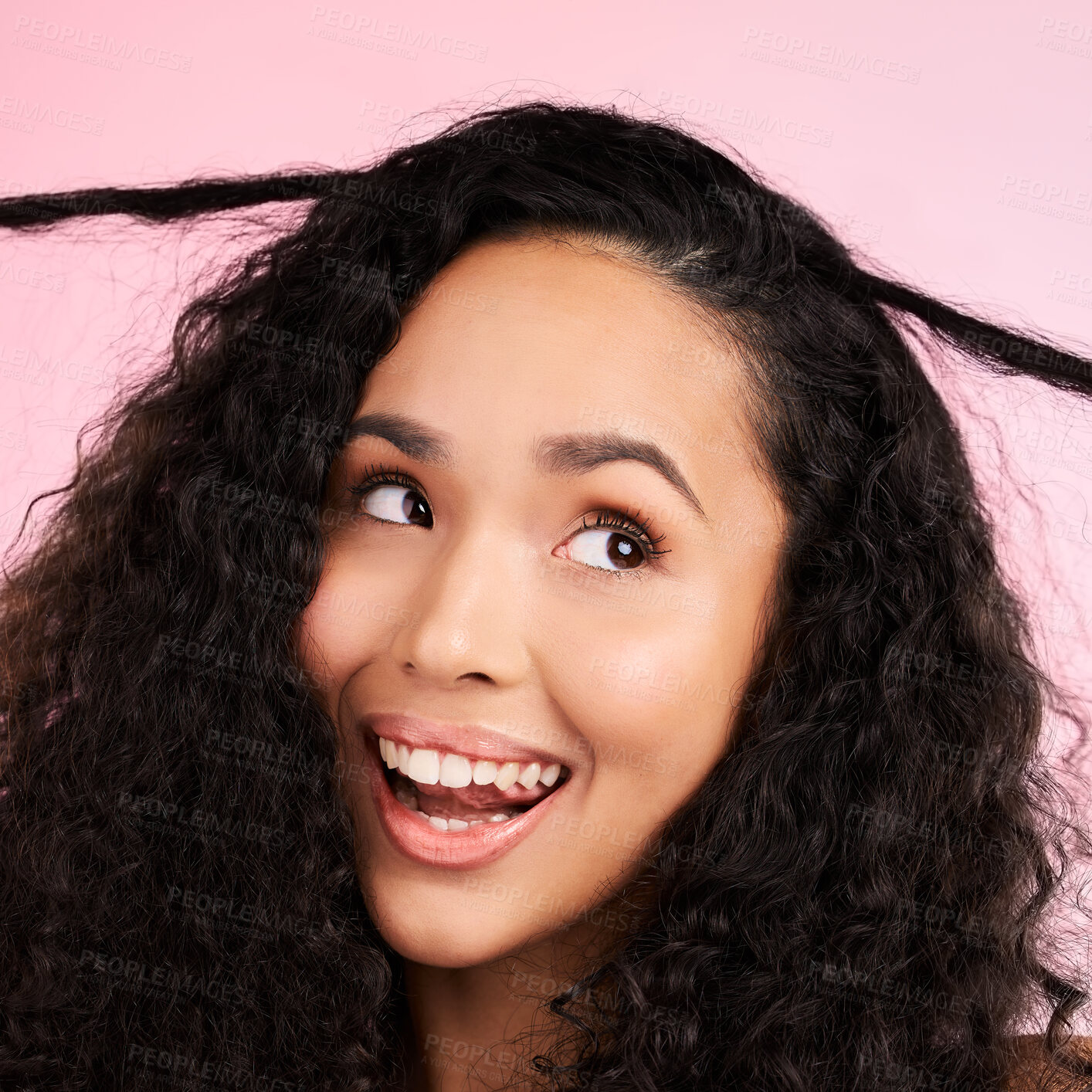 Buy stock photo Beauty, curly hair and smile with face of woman in studio for cosmetics, textures and salon treatment. Shampoo, skincare and hairstyle with model on pink background for self care, facial and glow