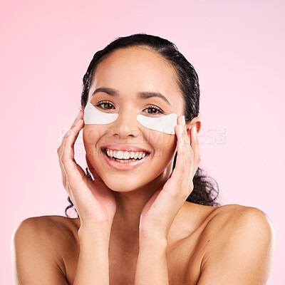 Buy stock photo Face, eye patch and beauty of a woman with natural skin glow on a pink background. Dermatology, collagen mask or cosmetics portrait of female model for facial shine, wellness or self care in studio
