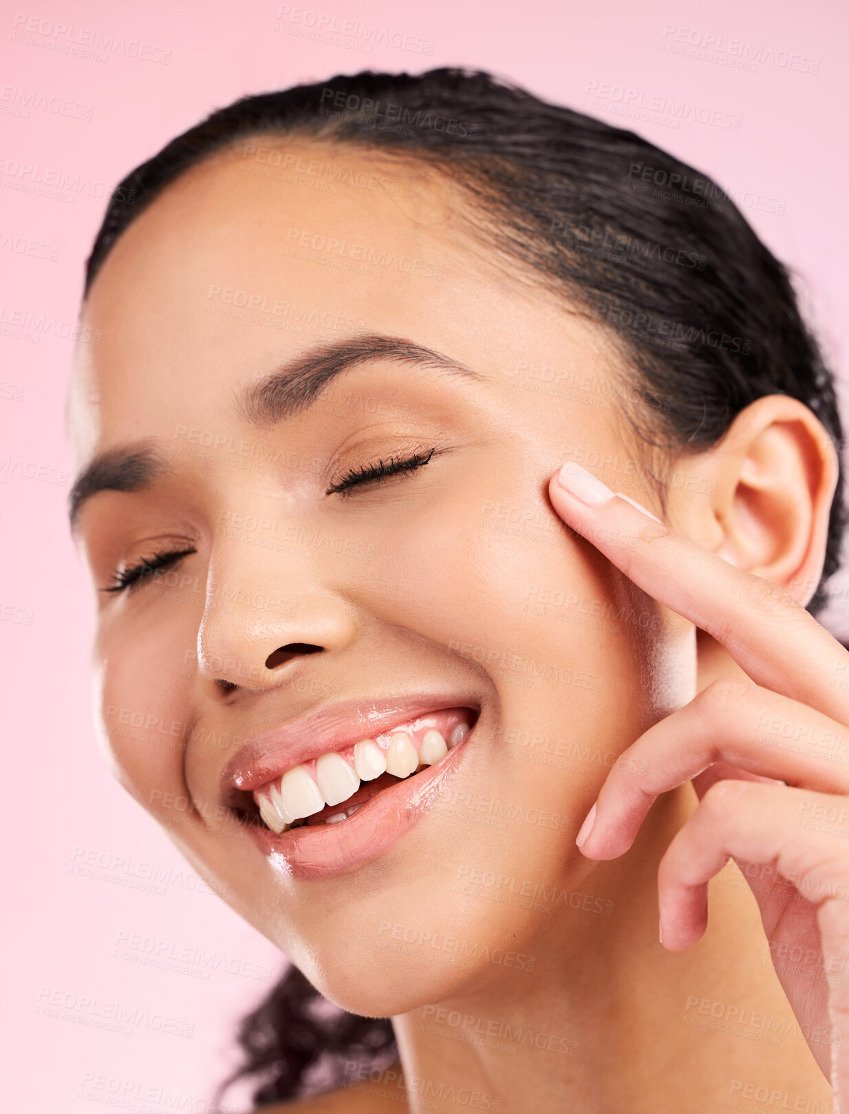 Buy stock photo Skin, beauty cream and face of a woman in studio for cosmetics, dermatology and glow. Headshot, moisturizer and natural skincare of a young female aesthetic model on a pink background with a smile