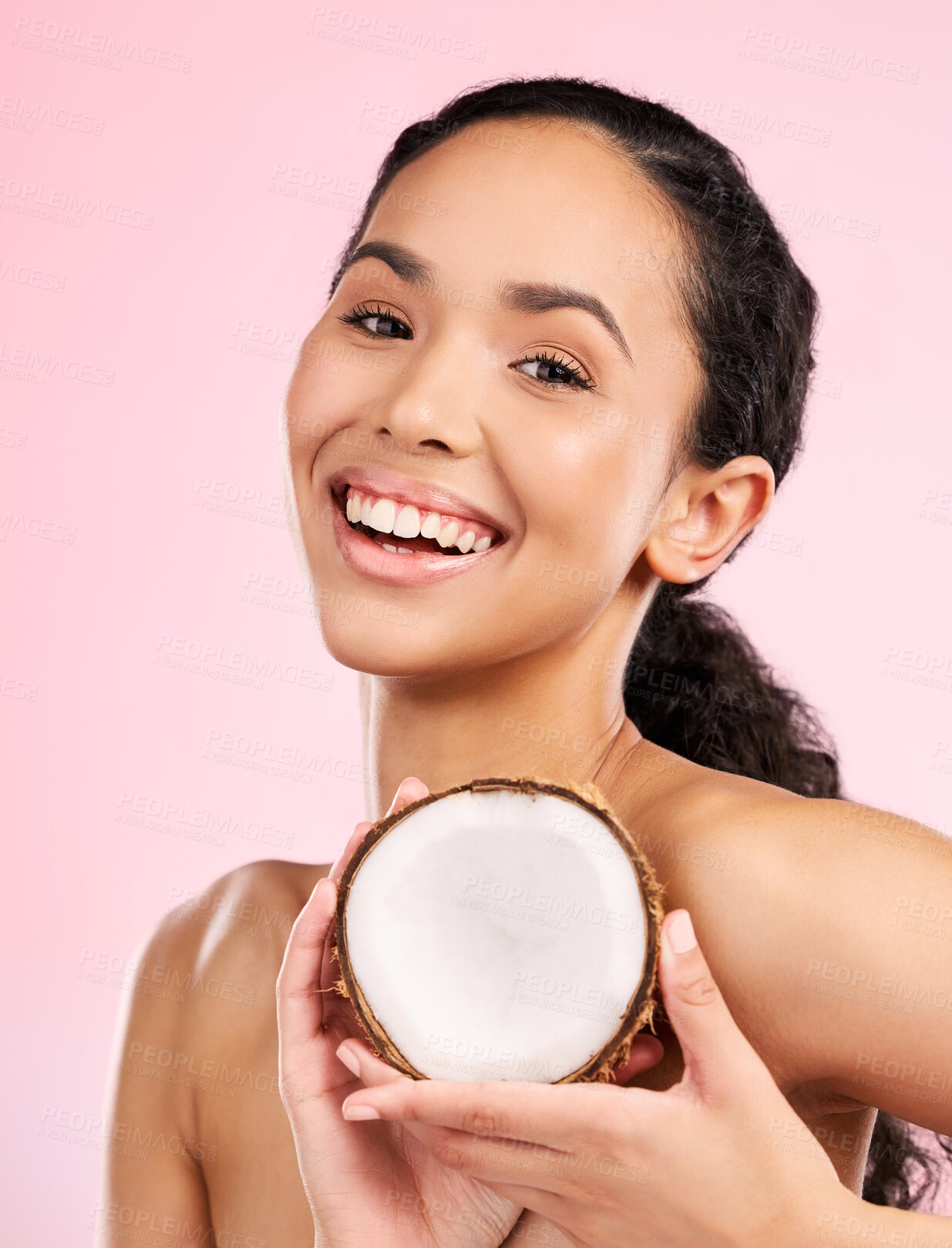 Buy stock photo Woman face, coconut fruit and skincare, natural beauty or vegan cream on pink, studio background. Portrait of african person with healthy product for dermatology, skin care cosmetics and oil benefits