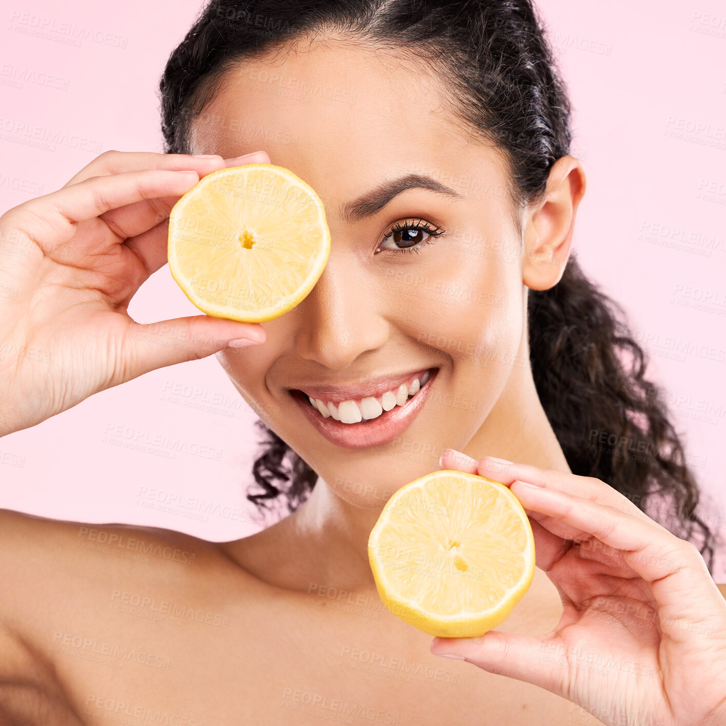 Buy stock photo Woman face, skincare portrait and lemon for beauty, cosmetics and natural product or vitamin c benefits. Happy, young person or model with fruits for eye dermatology on a pink, studio background