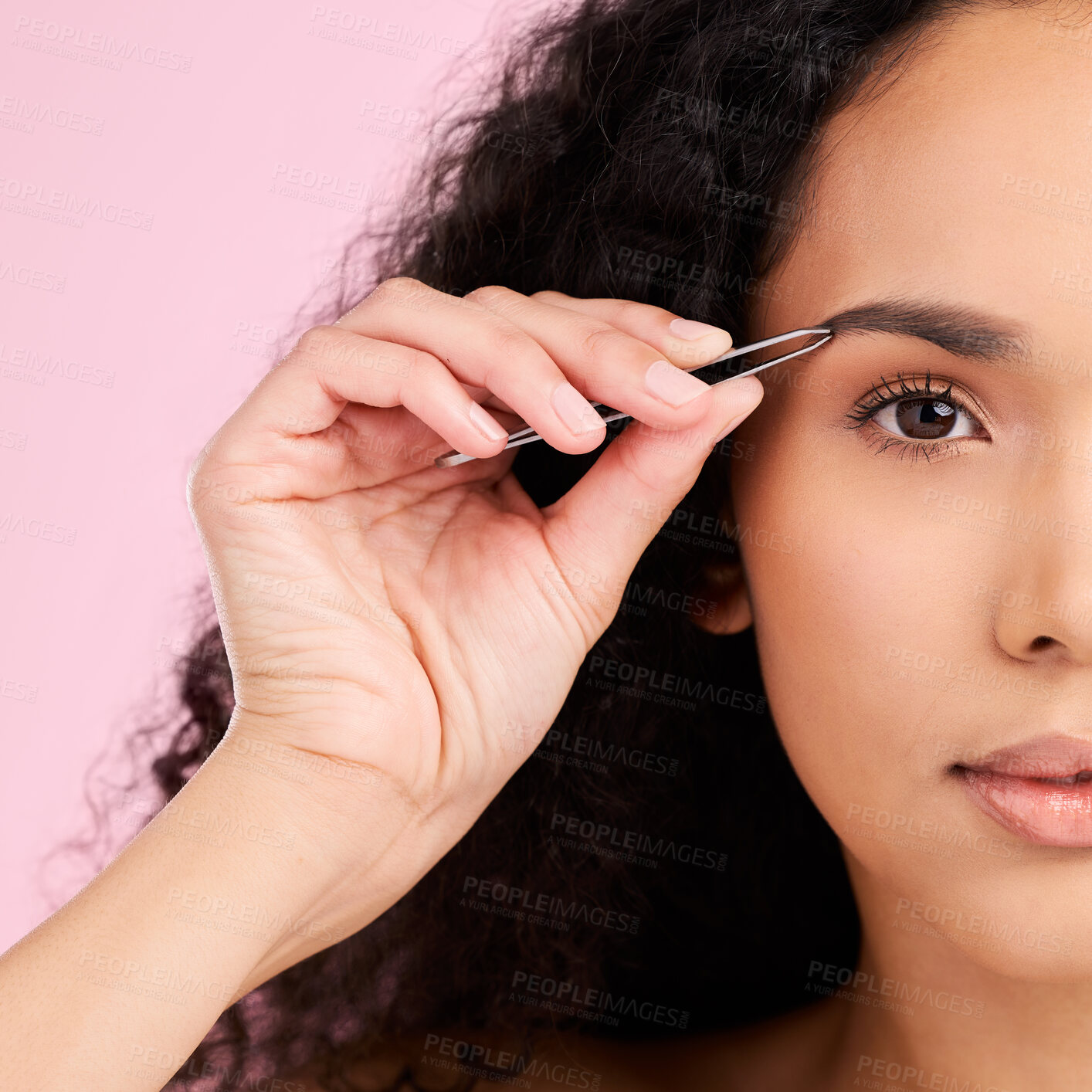 Buy stock photo Face, beauty and woman with tweezer for eyebrow, skincare and grooming isolated on a pink background. Natural portrait, facial plucking and hair removal of serious model for wellness and aesthetic