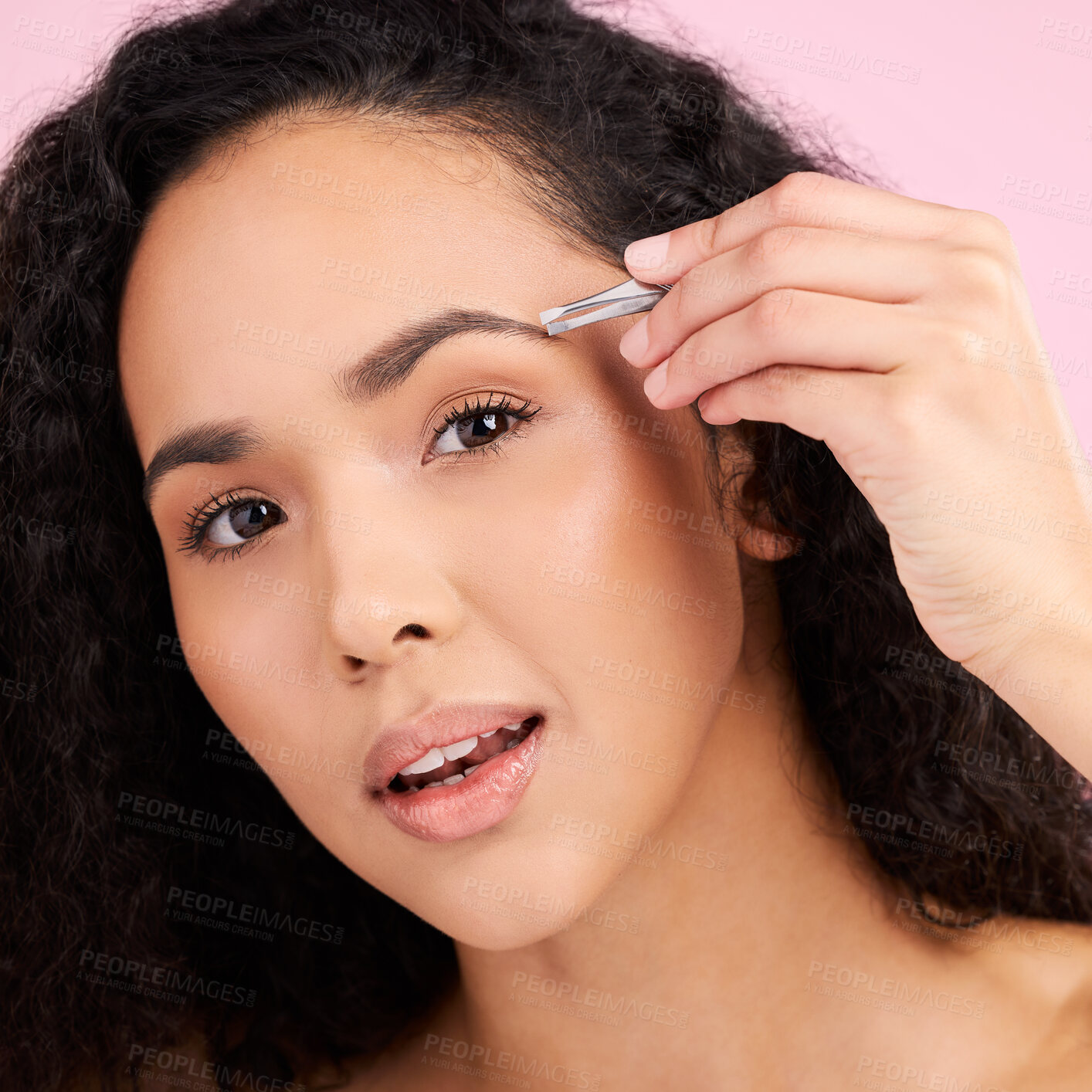 Buy stock photo Face, beauty and woman with tweezer for eyebrow in studio isolated on pink background. Natural portrait, facial plucking or hair removal of serious model for self care, wellness or grooming aesthetic