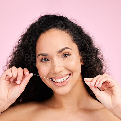 Buy stock photo Woman, dental flossing and studio portrait with smile, cleaning and self care for beauty by pink background. Girl, model and string for mouth, teeth whitening and happy for healthy gums with product