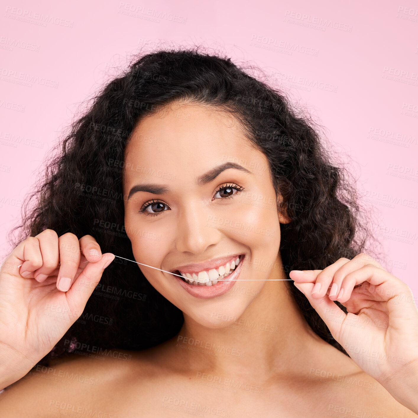 Buy stock photo Woman, dental flossing and studio portrait with smile, cleaning and self care for beauty by pink background. Girl, model and string for mouth, teeth whitening and happy for healthy gums with product