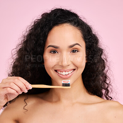 Buy stock photo Woman, wood toothbrush and studio portrait for dental wellness, cosmetics and healthy mouth by pink background. Girl, model and natural toothpaste for teeth whitening, self care and dentistry product