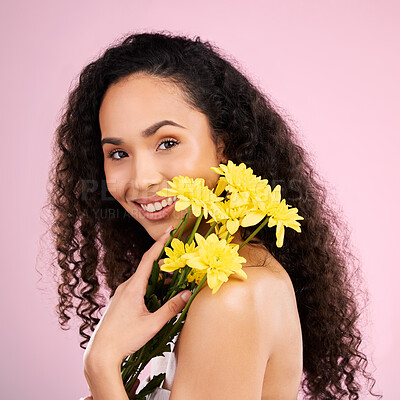 Buy stock photo Flowers, face and skincare of happy woman in studio isolated on a pink background. Portrait, smile or beauty model with plant, floral cosmetics or natural organic treatment for healthy skin aesthetic