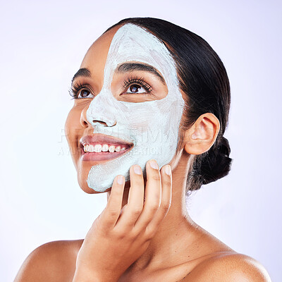 Buy stock photo Smile, face mask and woman in studio with skincare, results and dermatology wellness on grey background. Facial, comparison and female with half beauty, routine and clay product for skin exfoliation