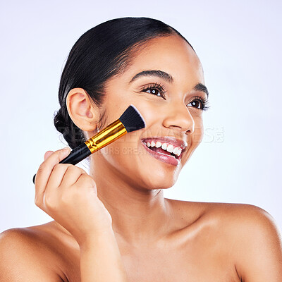 Buy stock photo Beauty, makeup brush and cosmetics of a happy woman in studio for skincare, self care and cosmetology. Skin glow, shine and wellness of a female model with facial application tools for foundation