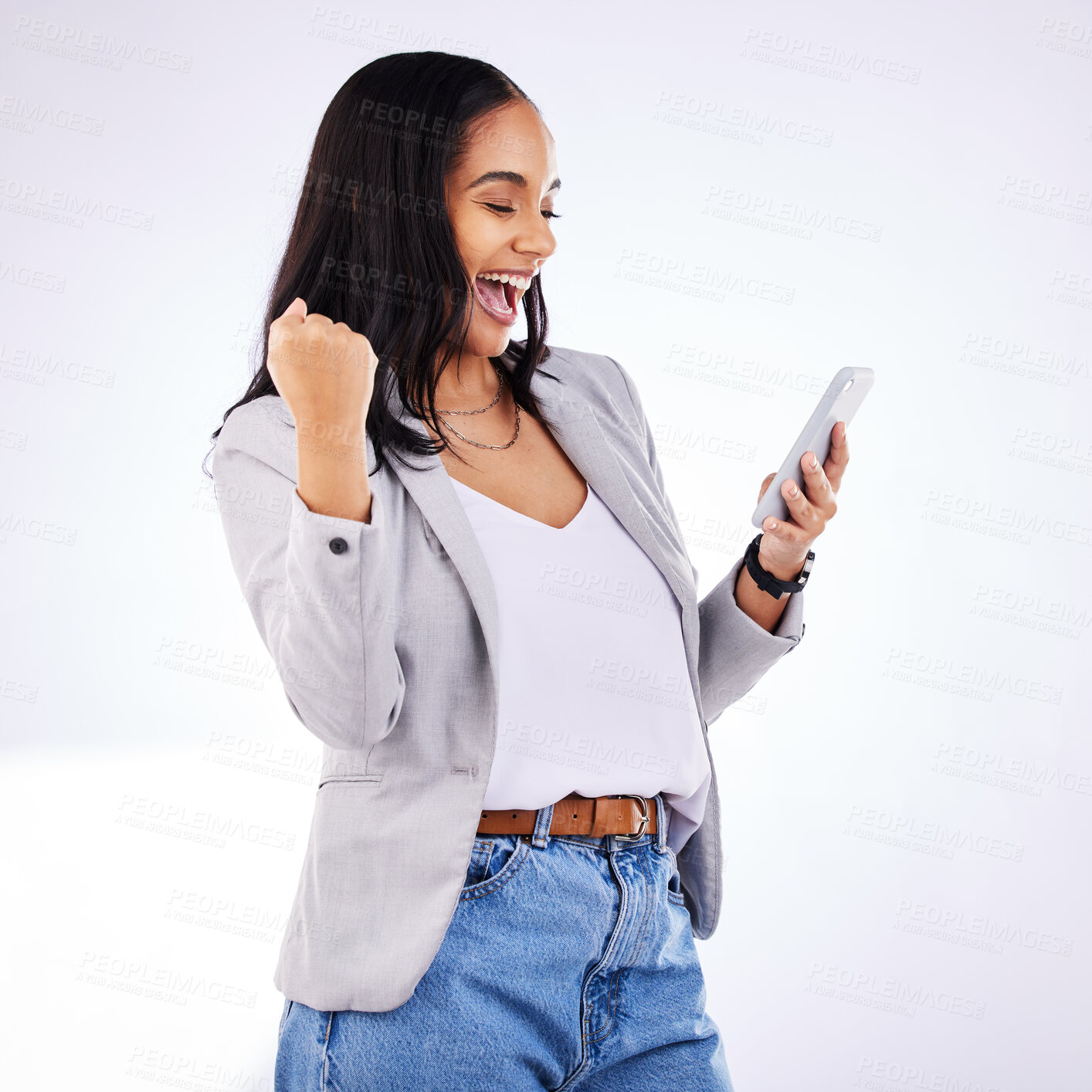 Buy stock photo Fist, celebration and happy woman with phone in studio for news, deal or sign up success on white background. Wow, hand and excited lady winner with smartphone for sale, discount or coming soon promo