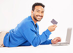 Online shopping, laptop or portrait of happy man with debit card for discount, fintech service or ecommerce sales. Customer payment, savings transfer or relax person banking on white background floor