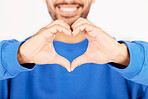 Closeup, heart and hands of man in studio, white background and care for kindness, donation and charity. Happy model with finger shape for love icon, thank you and emoji in support of valentines day