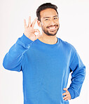 Okay hands, portrait and asian man in studio, isolated white background and vote of good review. Male model, smile and ok for success, agreement and icon for support, yes emoji and thank you sign 