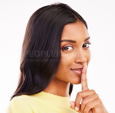 Buy stock photo Woman, secret and studio portrait with finger, lips and smile for deal, sale or discount promo by white background. Girl, student and face with hush, sign or emoji by mouth for gossip, story or news