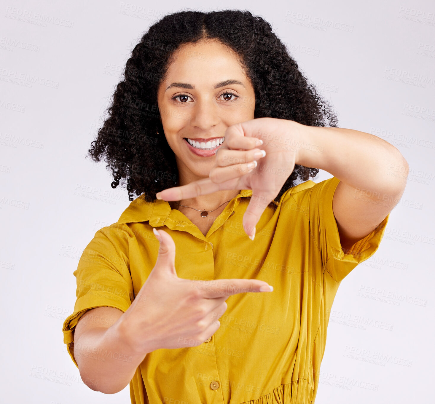 Buy stock photo Happy woman, portrait and frame hands for photography, picture or creativity against a white studio background. Female person or photographer smile framing with gesture, shape or icon in photo moment