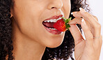 Healthy, eating or mouth of woman with strawberry in studio on white background for clean diet nutrition. Hand, bite closeup or girl model with beauty or natural fruits for nutrition or wellness