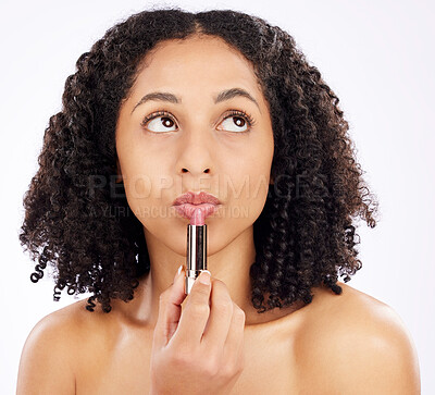 Buy stock photo Thinking, African woman and lipstick in studio with choice, decision or ideas for beauty on white background. Healthy, skin and makeup or model with a solution for self care, wellness and cosmetics