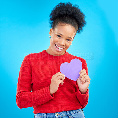 Buy stock photo Woman, portrait and heart cut out with a smile for love and valentines day in studio. African female person, blue background and romance emoji icon for kindness with a young happy model and paper