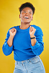 Happy, dance and young woman in studio for celebration, achievement or goal with confidence. Happiness, smile and African female model moving to music, song or playlist isolated by yellow background.