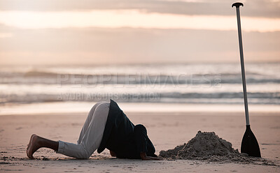 Buy stock photo Digging hole, search and a man on the beach for a vacation, treasure hunt or check underground. Nature, travel and a person with a shovel at the ocean during sunset or sunrise and playing in the sand