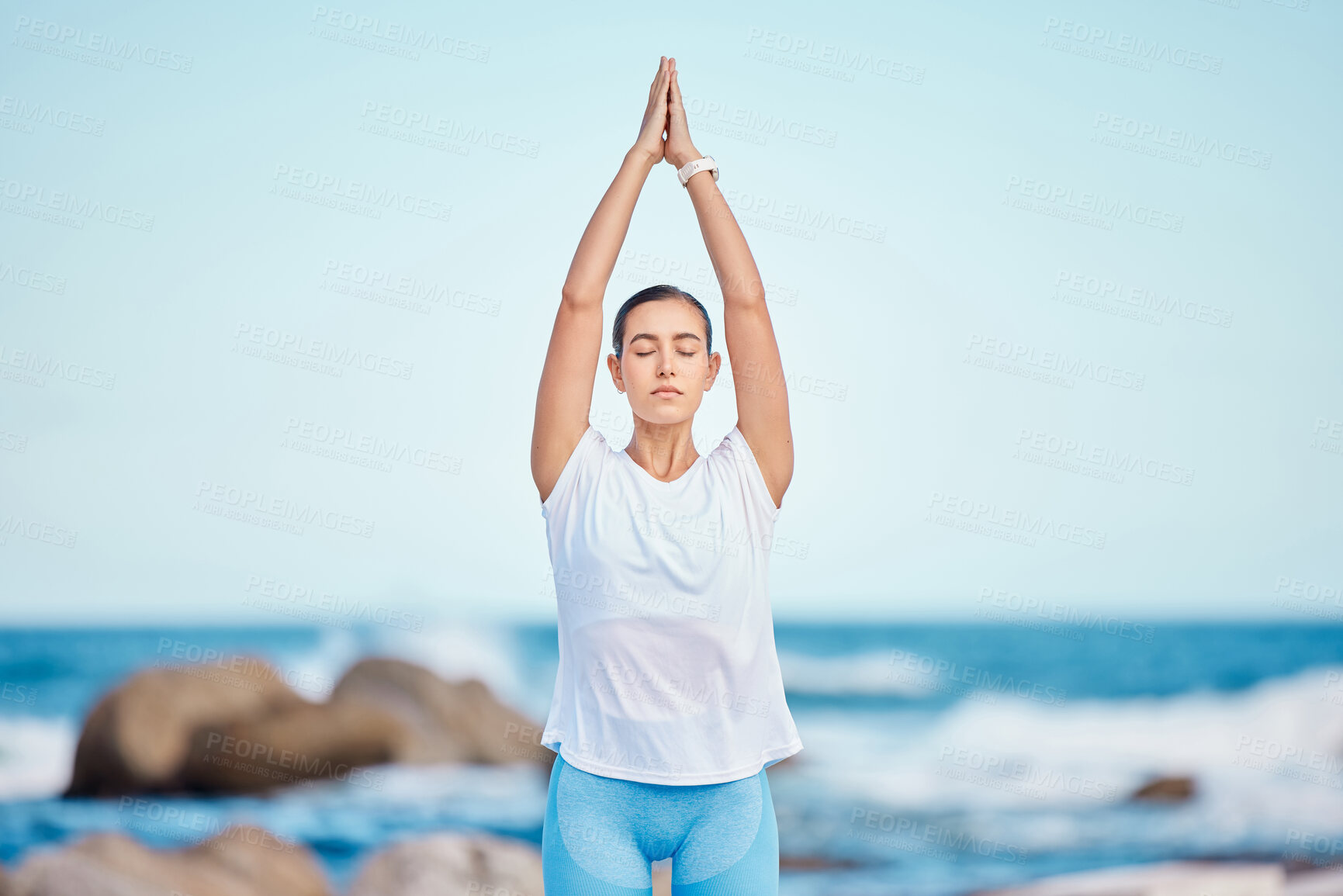 Buy stock photo Yoga, fitness and woman at the beach for workout or training as health, mindfulness and wellness routine. Healthy, body and person exercise a chakra by doing tree pose at the sea or in nature