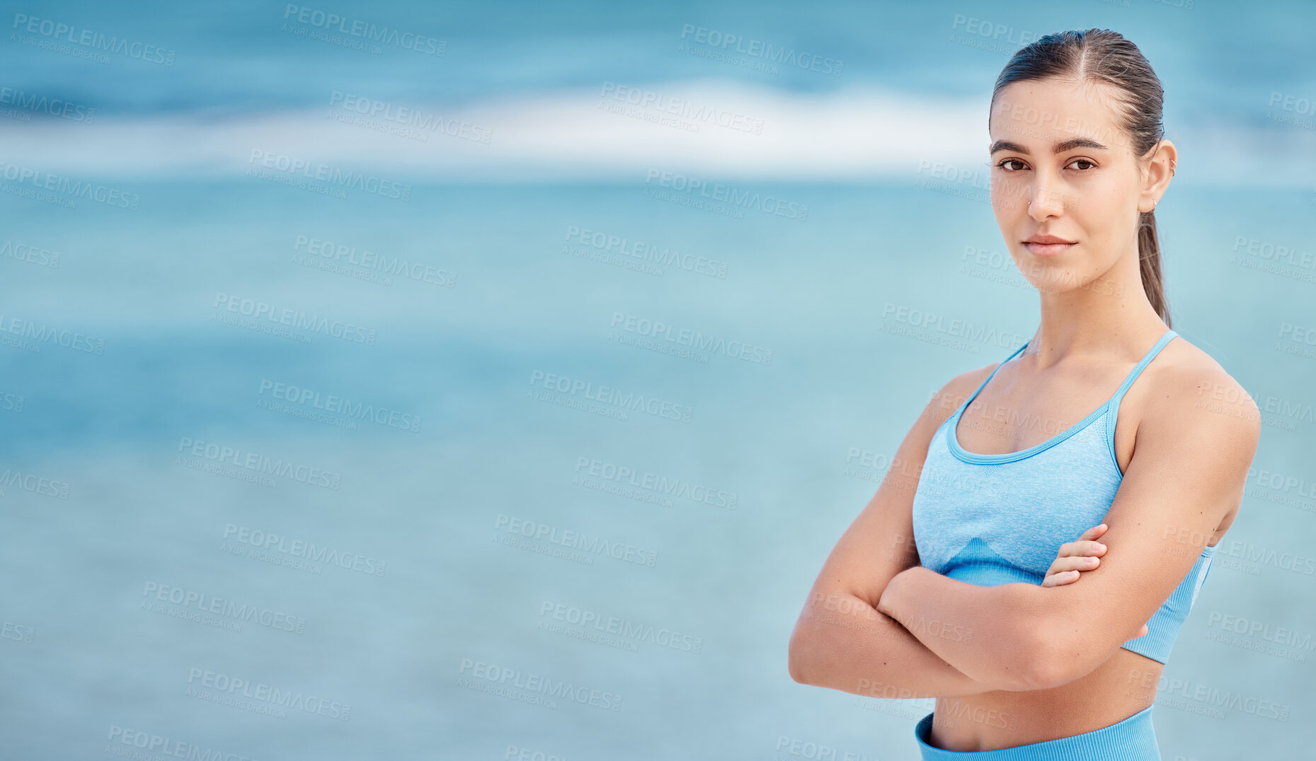 Buy stock photo Fitness, yoga and portrait of woman by beach with mockup space for wellness, healthy body and energy. Sports, nature and female person with crossed arms for exercise, training and workout by sea