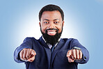 Business, portrait and black man hand pointing in studio for hiring, recruitment or opportunity on blue background. Face, smile and African male person show you, emoji and coming soon or contact us