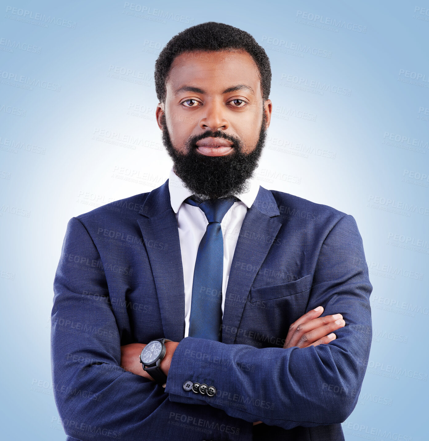 Buy stock photo Serious, crossed arms and portrait of businessman in a studio with success, confidence and leadership. Pride, professional and headshot of a young, male and African lawyer isolated by blue background