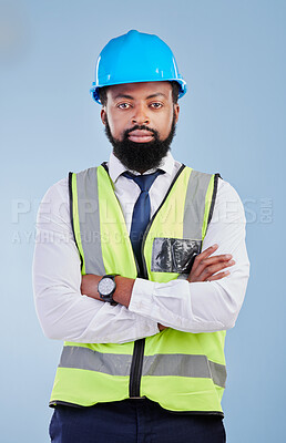 Buy stock photo Engineering, man or serious portrait with arms crossed in studio in development, building construction or industrial technician. Black male architect, contractor or project manager on blue background