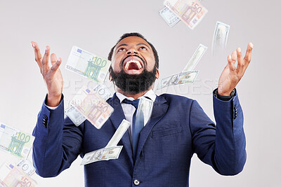 Buy stock photo Money, rain and happy black man in studio for savings, growth or cashback bonus on white background, Cash, shower and African winner with investment, success or financial freedom award celebration