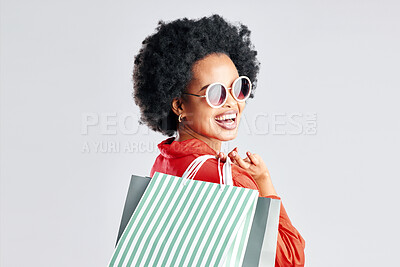 Buy stock photo Happy black woman, afro and shopping bags for discount, sale or fashion deal against a white studio background. Portrait of African female person, customer or shopper smile for purchase in happiness