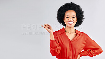 Buy stock photo Portrait, pointing and black woman mockup, smile and promotion against a white studio background. Face, female person and model with hand gesture, showing and choice with presentation and opportunity