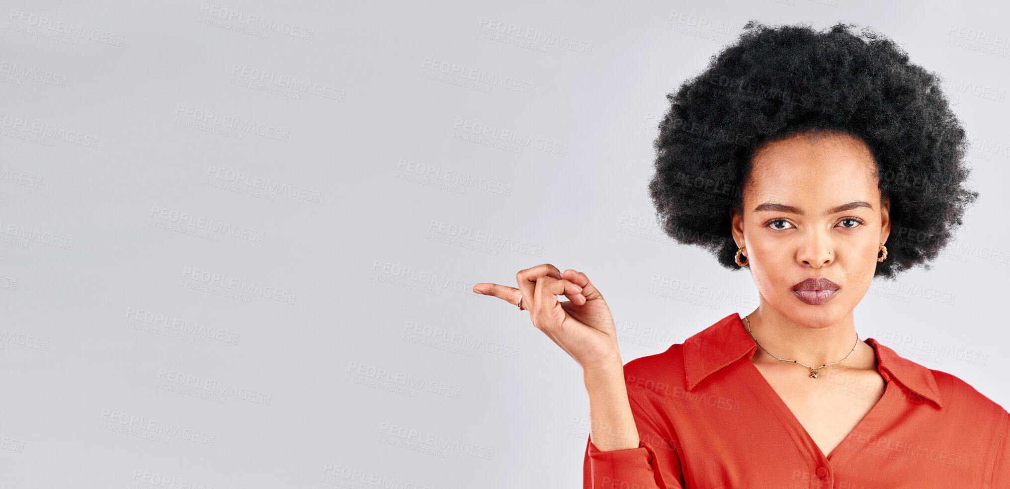 Buy stock photo Serious face, pointing and black woman mockup, opportunity and presenting against a white studio background. Portrait, female person and model with hand gesture, showing and choice with discount deal