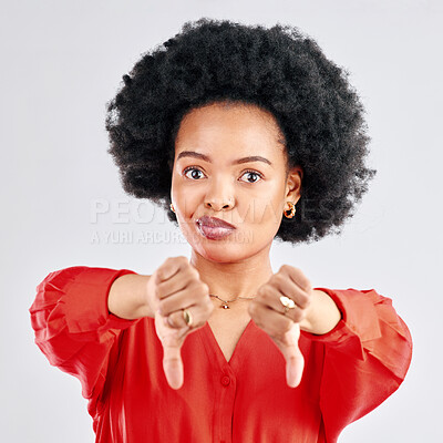 Buy stock photo Thumbs down, portrait and hands of black woman in studio reject bad news, emoji sign and feedback on white background. Face of female model show negative review, wrong decision or vote no for failure