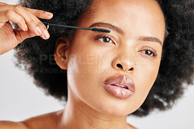 Buy stock photo Skincare, cosmetics and eyebrow brush for beauty with african girl in grey studio or background. Makeup, brow and woman with facial cosmetology for dermatology or glow for elegant natural face.