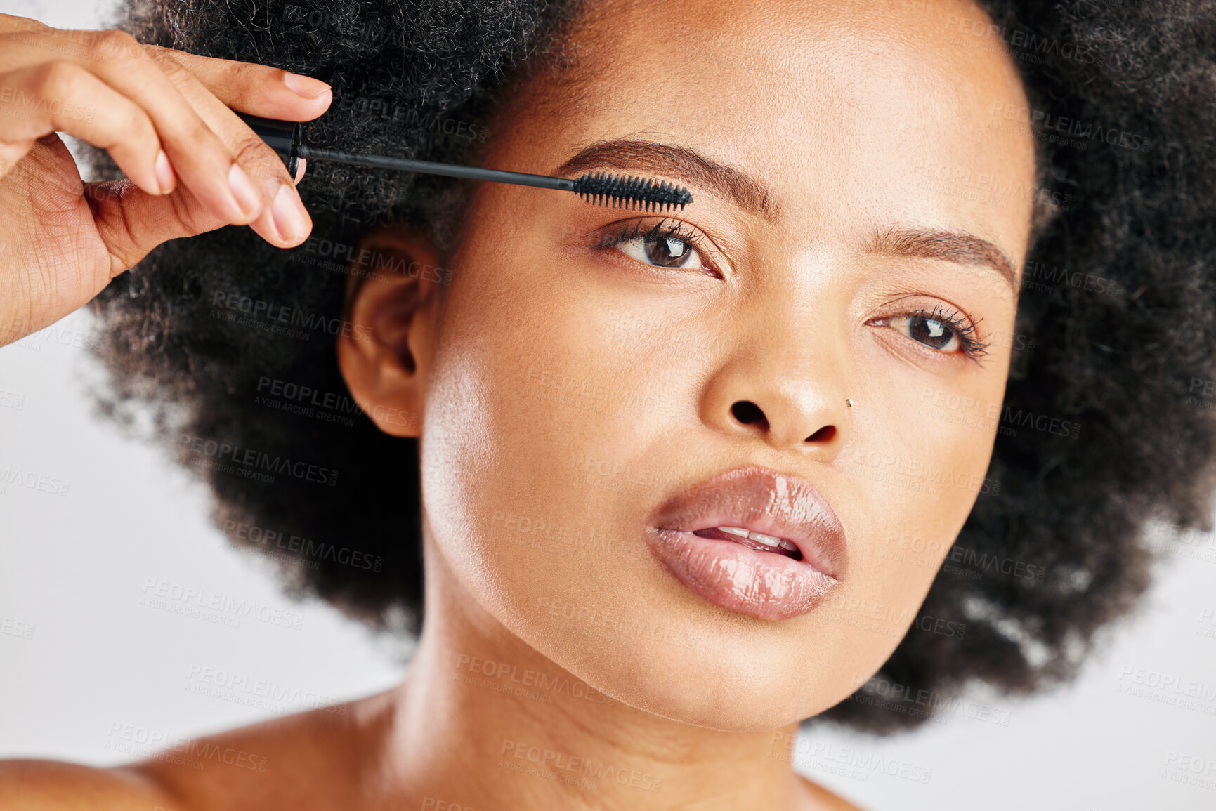 Buy stock photo Skincare, cosmetics and eyebrow brush for beauty with african girl in grey studio or background. Makeup, brow and woman with facial cosmetology for dermatology or glow for elegant natural face.