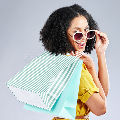 Buy stock photo Shopping, bag and portrait of woman excited for retail sale, promotion or discount on studio, mockup or grey background. Wow, customer and girl to shop for fashion or sales on luxury clothing