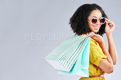 Buy stock photo Shopping, bag and woman happy for retail sale, promotion or excited for discount on studio, mockup or grey background. Customer, portrait or girl to shop for fashion or sales on luxury clothing