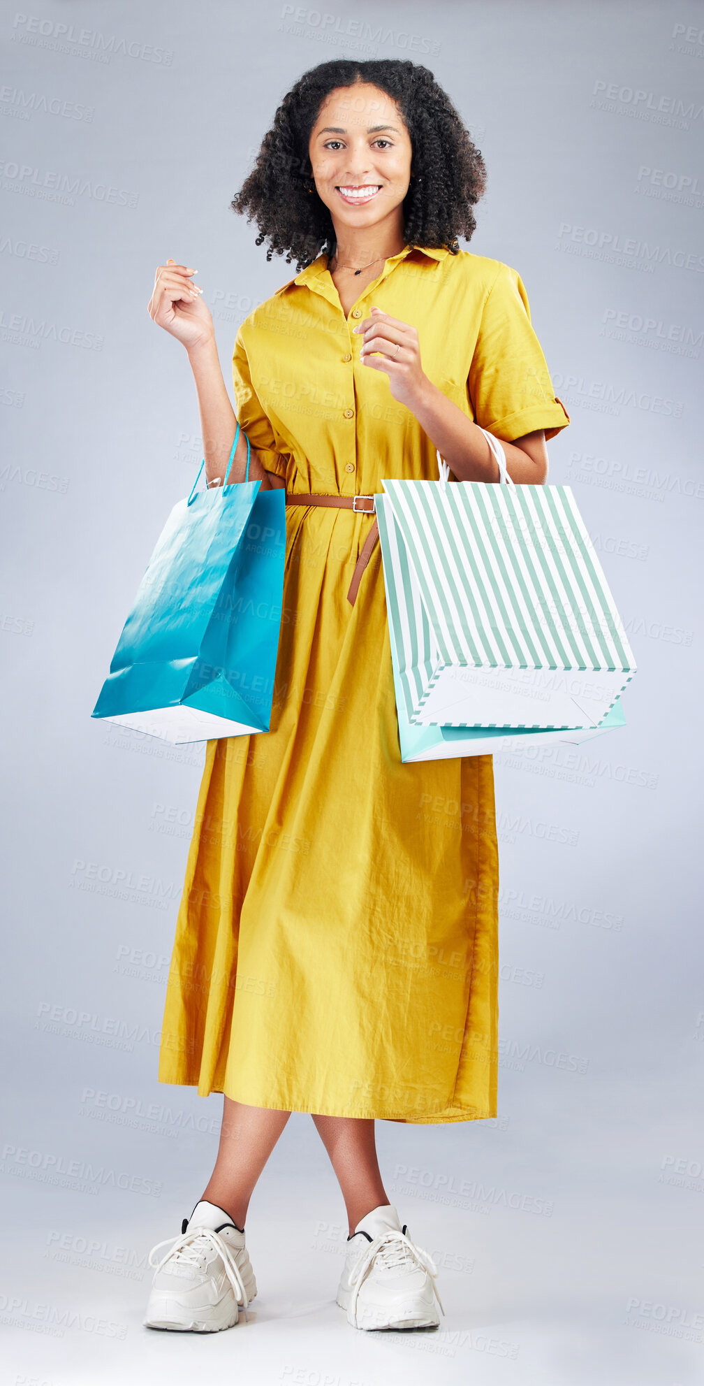 Buy stock photo Portrait, smile and woman with shopping bag for fashion in studio isolated on a white background. Happy, sales and African customer with gift, discount deal or clothes from shop, mall or retail store