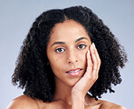 Portrait, hair and beauty with a model black woman in studio on a gray background for skincare. Face, aesthetic and shampoo with a young female person at the salon for luxury wellness or treatment